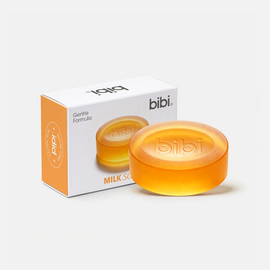 Two orange soap bars with a 'bibi' box on a white background